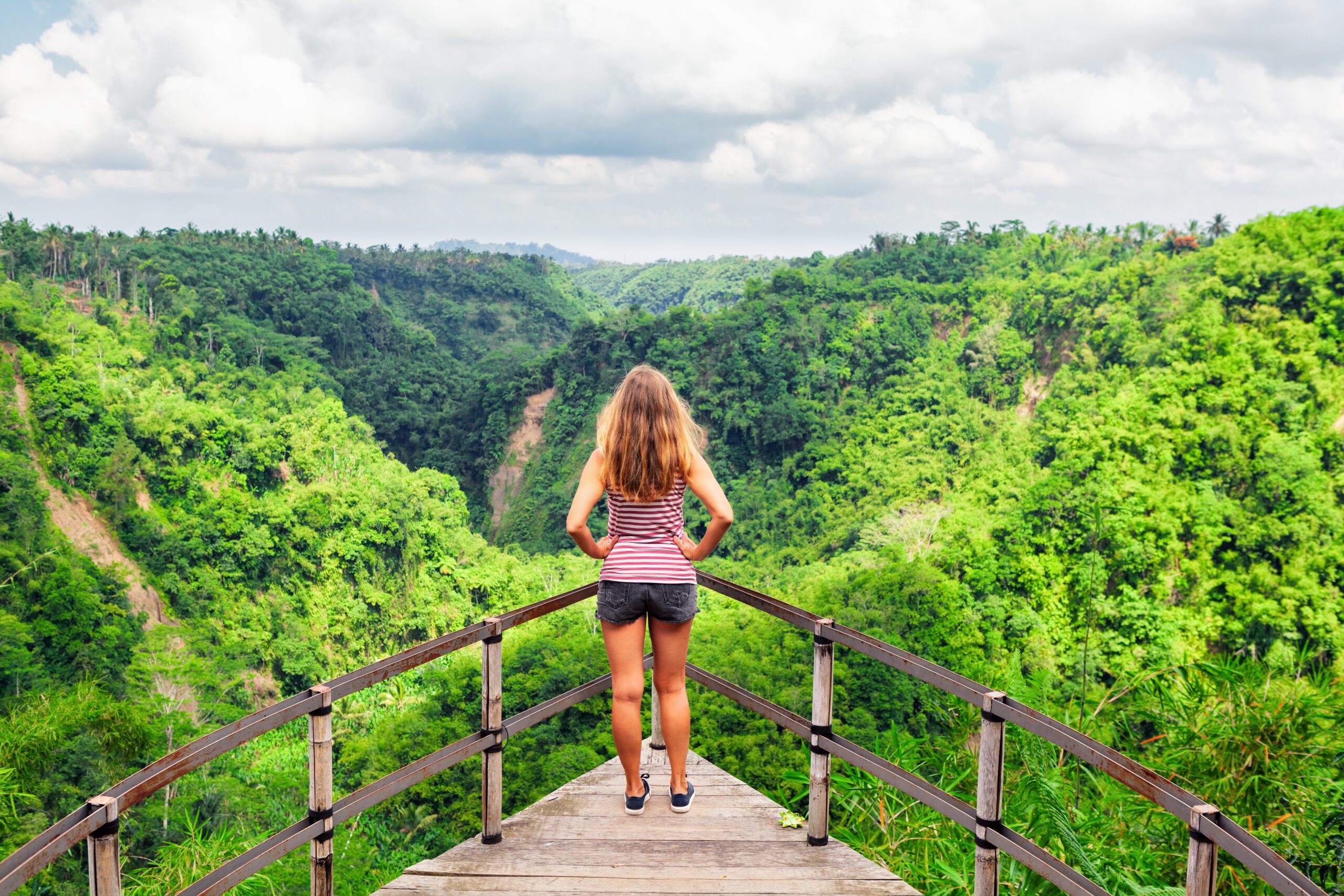 Woman Standing on Bridge