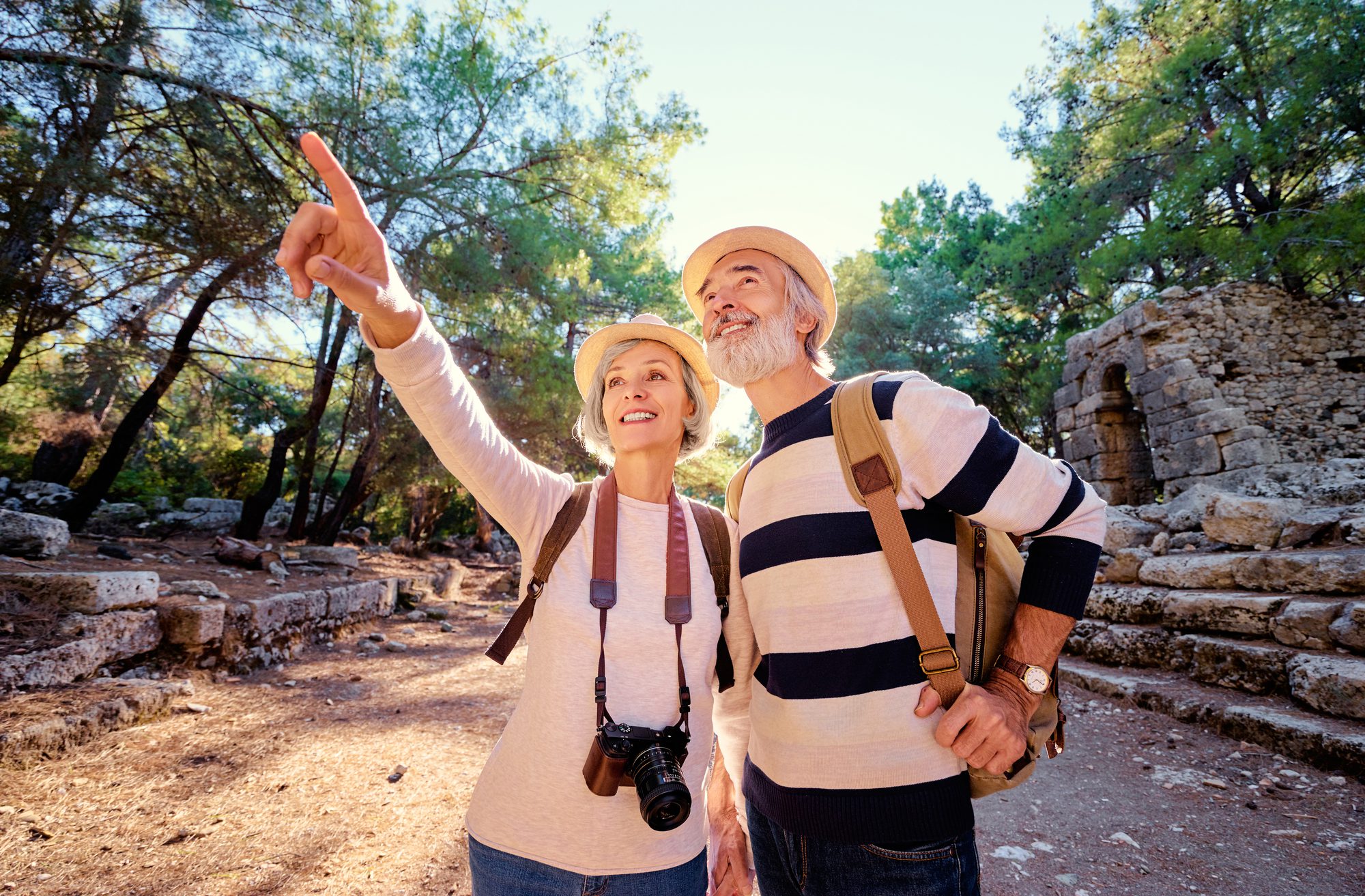 Senior family couple walking together on ancient sightseeing